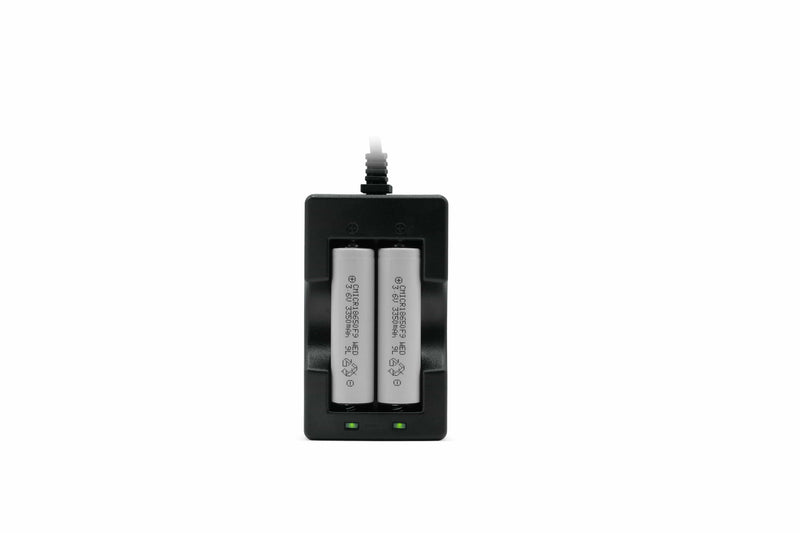 Front view of two grey removable batteries in a black Amalock battery charger, with green power lights on, compatible with Amalock DB101 and DB301 video doorbells
