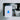 A white Amalock DB101 video doorbell Wi-Fi chime unit plugged into a chrome plug socket, featuring a blue illuminated bell ringing graphic