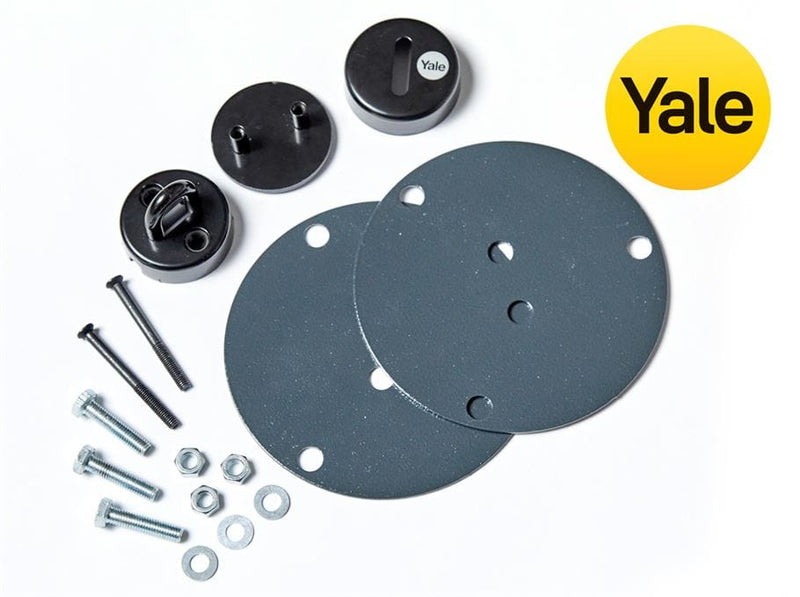 Image of Yale ground anchor kit items including fixing brackets and bolts;
Image of Yale ground anchor fixed to wooden floor in Asgard metal shed;
Image of Yale ground anchor being screwed down to wooden floor with hand drill;
Image of Yale ground anchor securing a bike to wooden floor inside Asgard shed ;